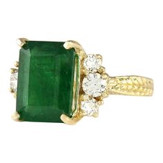 Stamped: 14K Yellow Gold Total Ring Weight: 8.2 Grams Ring Length: N/ARing Width: N/A Gemstone Weight: Total Natural Emerald Weight is 5.78 Carat (Measures: 12.35x9.20 mm) Color: Green Diamond Weight: Total Natural Diamond Weight is 0.60 Carat Quantity: 6 Color: F-G, Clarity: VS2-SI1 Face Measures: 12.35x16.65 mm Sku: [704051W] Yellow Gold Emerald Cut Multi-stone Ring, Gia Certified Yellow Gold Emerald Ring For Formal Occasions, Elegant Gold Gia Certified Gemstones, Elegant Gold Gemstones Gia Certified, Formal Gia Certified Yellow Gold Emerald Ring, Elegant Gia Certified Gold Gemstones, Luxury Formal Rings For May Birthstone, Elegant Multi-stone Emerald Ring In Gold, Elegant Gold Multi-stone Emerald Ring