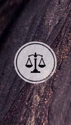 the scales of justice sticker is shown in white and black on a dark background