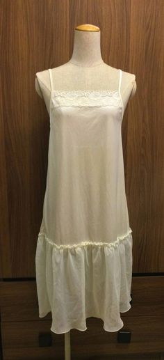 90s Vintage Lace Trim Creamy White/Ivory Underdress  - Beautiful to wear as underdress or slip dress - made with nylon - Straps are adjustable - About knee length - Some scratches on the dress (as seen in the photos) - General vintage condition - Measurements: Size: S  Armpit to armpit: 16" * Bust up to 32" Length (include the strap): approx 38"  Length (not include the strap): 33" Waist: 34" Hips: 36" - Shipping Time: US (EAST COAST) - 14-21 business days US (WEST COAST) - 10-14 business days UK - 14-21 business days Canada, Europe, Asia Pacific (include Australia & New Zealand) and Other Regions - 14-21 business days Rush orders available at an additional shipping cost. ❀ PLEASE FAVORITE Whatthefunk shop to see daily studio photos & follow us on Instagram for coupon codes & giveaways Brandy Dress, Dresses Night, Night Gown Dress, White Slip Dress, Slip Dresses, White Slip, Gown Dress, Prom Party Dresses, Creamy White