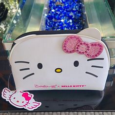 a hello kitty purse with pink sequins on it