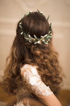 the back of a woman's head wearing a flower crown