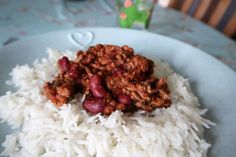 a white plate topped with rice and beans