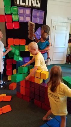 children playing with blocks in a play room