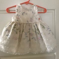 Nwot. Ivory With Floral Embroidered Sheer Overlay. Tulle Underneath For Fluff. Bloomers Included. Size 6 Month. Sleeveless Floral Embroidered Baptism Dress, White Baptism Dress With Floral Embroidery, White Floral Embroidered Dress For Baptism, Spring Embroidered Baptism Dress, Cream Baptism Dress For Spring, American Princess, Baby Girl Dresses, Kids' Dresses, Princess Dress