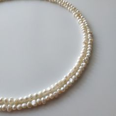 "< Small Beads Pearl Necklace > It is well known fact, that pearls are the best accessory for weddings. But it is not only bridal jewelry. As Jackie Keneddy once said \"Pearls are always appropriate\". We can not disagree with this. Pearl jewelry is same perfect for special occasions and daily life. There is nothing more elegent and feminine like pearls. Every woman should have such a perfect beauty in her jewelry box. Necklace's length: The first string - 36cm (14,1 in) Number of strings Single Strand Round Beaded Pearl Necklace For Wedding, Single Strand Pearl Necklace With Round Beads For Wedding, Wedding Pearl Necklace With Single Strand Of Round Beads, Traditional Single Strand Pearl Necklace For Wedding, Adjustable Beaded Necklace With Pearl Pendant For Wedding, Double Strand Pearl Necklace For Wedding, Bohemian Pearl Pendant Necklace For Weddings, Adjustable Long Beaded Necklace For Wedding, Bohemian Beaded Pearl Necklace For Weddings