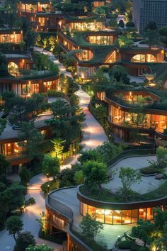 an aerial view of a building with trees on the roof and lights in the windows