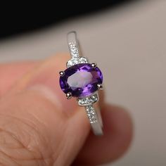 This is a gorgeous handmade creation. Its beauty is its simplicity & Elegance. The 6*8mm oval cut natural amethyst is crafted in solid sterling silver and with rhodium plated. It is available to customized, if you have any mind, just let me know, we will discuss with it. All item is sent in a beautiful gift box You can realize more lovely stuff clicking the link https://www.etsy.com/shop/knightjewelry?refshopsection_shophome_leftnav Please leave the correct address and you PHONE NUMBER for d Oval Amethyst Gemstone With Center Stone, Oval Amethyst Gemstones With Prong Setting, Lavender Oval Amethyst Ring With Gemstone Accents, Oval Amethyst Crystal Ring For Anniversary, Oval Amethyst Ring With Accent Stones, Oval Purple Amethyst Ring For Gift, Oval Solitaire Amethyst Ring Gift, Oval Purple Solitaire Birthstone Ring, Oval Purple Gemstone Rings