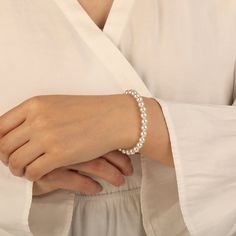 Add luxury and beauty to your look with this pearl bracelet. White pearls are gracefully arranged in a single strand for a refined look. Each lustrous pearl, meticulously chosen for its radiant luster, exudes natural beauty. Subtle and elegant, this bracelet will compliment both casual and dressy outfits. A delicate piece perfect for everyday wear or special occasions. *Each piece is handmade, resulting in a potential variance of 0.1-0.2mm during measurement. Please refer to the actual item for Formal Pearl Bracelet With Pearl Charm, Elegant Pearl Bracelet With Pearl Chain, Elegant Pearl Drop Bracelet, Pearl White Pearl Beaded Jubilee Bracelets, Pearl White Pearl Beaded Jubilee Bracelet, Formal Pearl Beaded Bracelets With Pearl Chain, Elegant Pearl Bracelet For Formal Occasions, Elegant Pearl Bracelet With Jubilee Detail, Elegant Pearl Beaded Bracelets With Pearl Charm