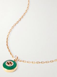 Gucci's 18-karat gold necklace is accented with a sparkling diamond and strung with an agate pendant engraved with the 'GG' motif - a signature logo that debuted in the '60s. The adjustable clasp fastening allows you to customize the drop. Gucci Necklace With Polished Finish As Gift, Elegant Gucci Necklace With Polished Finish, Gucci Necklace With Polished Finish For Gift, Gucci Polished Finish Necklace For Gift, Gucci Diamond Jewelry In Yellow Gold, Gucci Yellow Gold Diamond Jewelry, Gucci Jewelry With Polished Finish For Gift, Gucci Diamond Round Jewelry, Gucci Gold Diamond Jewelry