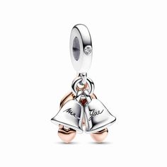 Let the bells ring for the happy couple! The Two-tone Wedding Bells Double Dangle Charm is a celebration of a new milestone in your love story. It features two dangling wedding bells in sterling silver, each with a small 14k rose gold-plated heart dangle inside - one bell is engraved with "You" and the other with "Me". A 14k rose gold-plated disc engraved with the message "Just married" completes the charm. Wear it on your favorite bracelet or charm holder as a memento of your special day and a celebration of all the new memories you'll make together. Pandora Wedding, Bracelet Pandora, Charm Holder, Wedding Pendant, Turtle Charm, Silver Bells, Pandora Charm, Thomas Sabo, Pandora Bracelets