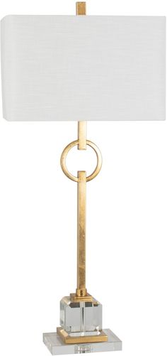 a table lamp with a white shade on the top and a gold frame around it