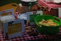 there are many items on the table for children's birthdays to eat and drink