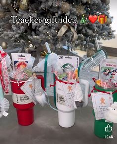 three starbucks coffee cups with christmas gifts in them