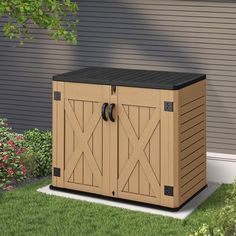 an outdoor storage shed with two doors on the side and grass in front of it