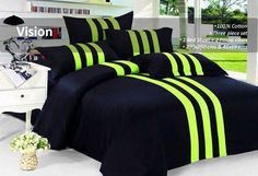 a bed with black and green striped sheets