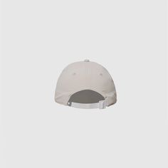 a white baseball cap on a gray background