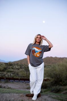 One of our most favorite designs is back and better.

Meet the Rocky Mountain Tee-your new favorite graphic tee. Crafted in the USA, this tee is the perfect addition to your outdoorsy wardrobe.  Whether you're summiting peaks or busting a move with the local wildlife, our tee ensures you're effortlessly rocking the Rockies in style! 🏞️🎉 Casual Relaxed Fit T-shirt For Outdoor Activities, Casual Relaxed Fit Tops For Hiking, Cotton Relaxed Fit Top For Hiking, Relaxed Cotton Top For Hiking, Casual Tops With Front Print For Outdoor Activities, Relaxed Fit Screen Print Tops For Outdoor Activities, Casual Graphic Print Tops For Outdoor Activities, Relaxed Fit Cotton Top For Hiking, Outdoor Relaxed Fit Top With Front Print