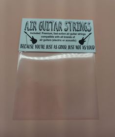 an air guitar strings sticker on top of a plastic bag