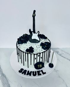 a black and white cake with the number twenty on it