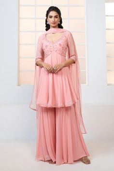 Peach peplum kurta with resham, beads and sequin floral pattern embroidery. Comes with sharara and scatter embroidered dupatta. - Aza Fashions Designer Peplum Set In Georgette, Designer Peplum Salwar Kameez, Anarkali Dress With Sheer Dupatta And Peplum Shape, Wedding Anarkali Dress With Peplum Shape, Designer Georgette Sharara With Peplum, Georgette Peplum Sharara For Designer Events, Georgette Sharara With Peplum For Designer Wear, Elegant Palazzo Set With Dupatta In Peplum Style, Elegant Peplum Anarkali Set For Wedding