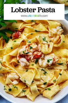 lobster pasta in a white bowl with parsley on top and text overlay that reads lobster pasta