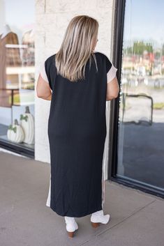 Ribbed Midi Dress Get ready to turn heads this season with our Autumn Maxi Black Dress! This solid ribbed dress features cap sleeves and a round neck, with a midi length for a flattering fit. Contrasting solid trim adds an extra touch of sophistication. Perfect for any occasion. Fits true to size Model is 5'3" wearing a Large Unlined but non sheer Split at hem. 95% Polyester, 5% Spandex Machine Wash | Line Dry Pockets at side Black Ribbed Long Maxi Dress, Black Ribbed Dress With Crew Neck, Black Ribbed Crew Neck Dress, Black Short Sleeve Maxi Dress For Loungewear, Cute Fall Dresses, Maxi Black Dress, Dresses For Church, Fall Midi, Midi Black Dress