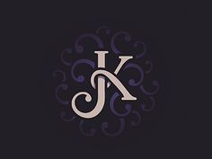 the letter k is made up of swirls and scrolls on a black background with an elegant monogram