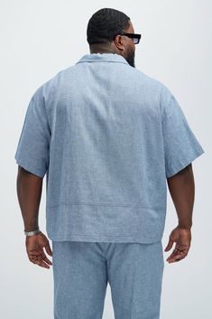 Available In Blue, Ice Blue, White, Stone, Oatmeal, Green and Black Fold Down Collar Front Button Closure Chest Pockets Short Sleeve 55% Linen, 45% Cotton Pair With "Bahamas Linen Cargo Shorts" Pair With "Bahamas Linen Shorts" Pair With "Bahamas Linen Pants" Imported | Mens Bahamas Linen Cuban Shirt in Blue size XL by Fashion Nova Blue Linen Short Sleeve Camp Shirt, Blue Linen Camp Shirt With Relaxed Fit, Blue Relaxed Fit Linen Camp Shirt, Casual Light Blue Top With Spread Collar, Light Blue Shirt With Relaxed Fit And Spread Collar, Casual Blue Linen Camp Shirt, Light Blue Linen Short Sleeve Top, Light Blue Linen Casual Tops, Casual Light Blue Linen Tops