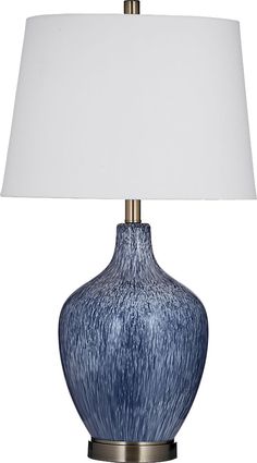 a blue table lamp with a white shade