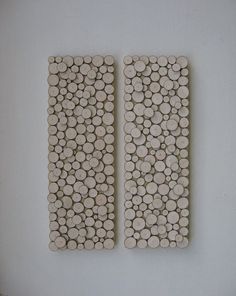 two pieces of wood with circles on them