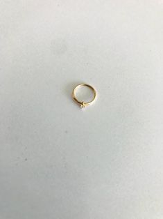 14K Yellow Gold, Hoop with Cubic ZC Nose Ring, Yellow Gold Nose Ring, Hoop Nose Ring ♦ Materials: 14K Gold ♦ Available colors: Yellow Gold ♦ Hoop Measurements: 9 Millimeters Diameter ♦ Cauge Thickness: 20G ♦ Cubic ZC Size: 1.5 Millimeter ♦ Stamped: 14K PLEASE REFER TO THE ACTUAL DIMENSIONS. WE HAVE ENLARGED THE PICTURES FOR A BETTER VIEW-------------------------------------------------- ♦ --------------------------------------------------MATERIALS14K GoldPRODUCTION TIMESOrder processing time var Small Hoop 14k Rose Gold Rings, Everyday Hoop Rings With Prong Setting, Small Hoop Rose Gold Rings For Anniversary, Minimalist Hoop Rings With Halo Detail, Minimalist Hoop Rings With Halo, 14k Gold Halo Huggie Rings, Hoop Septum Ring With Prong Setting As Gift, Small Hoop Yellow Gold Halo Rings, Minimalist Hoop Rings With Prong Setting