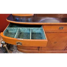 an old wooden desk with two drawers open