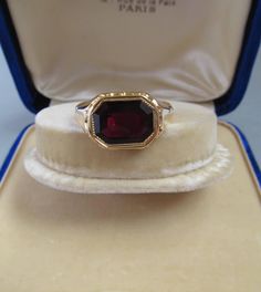 Antique Gold and Garnet Signet Ring - 18K Gold With an 18K gold Hungarian hallmark that was used from 1867. This ring is in very good condition. The head of the ring is 0.497 inches (12.65 mm) long and 0.685 inches (17.42 mm) wide Size of the stone: 0.38 inches (9.58 mm) long and 0.53 inches (13.43 mm) wide Inside diameter: 0.88 inches (22.6 mm) Size: USA 13.5 UK Z1-Z2 EU 71 Weight: 9.7 grams The box is not part of the auction. Free world-wide shipping by FedEx. Antique Engraved 14k Gold Ring For Formal Occasions, Gold Gemstone Signet Ring For Formal Occasions, Antique 14k Gold Rare Signet Ring, Antique Hallmarked Signet Ring For Formal Occasions, Formal Yellow Gold Ruby Ring, Antique Gold Signet Ring With Gemstone, Victorian Gold Signet Ring For Formal Occasions, Antique 14k Yellow Gold Ruby Ring, Victorian Gold Signet Ring With Gemstone