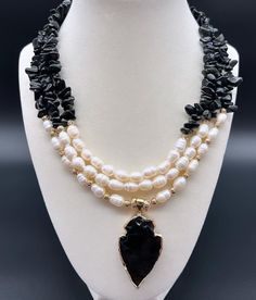 levate your style with this exquisitely crafted handmade necklace, featuring the powerful Black Agate Onyx Stone, the purity of Natural Freshwater Pearl, and the grounding energy of Black Obsidian Natural Stone. The centerpiece Agate Pendant adds a touch of sophistication. Meticulously designed, this one-of-a-kind piece beautifully combines elegance and natural energy, making it a statement accessory that speaks of strength, purity, and grounding. Women Birthday Gifts, Handmade Ceramic Jewelry, Creative Necklace, Obsidian Necklace, Onyx Jewelry, Women Birthday, Onyx Necklace, Mom Necklace, Black Agate