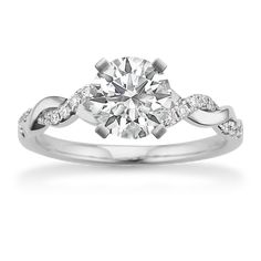 a white gold engagement ring with diamonds on it