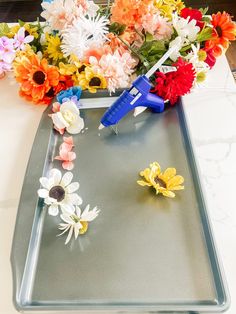 the flowers are laying on the tray ready to be cut