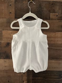 "Adorable, comfortable, and soft baby romper for your precious little love!  Made of 100% bubble gauze cotton, it is washable and durable for hours of baby fun.  The soft elastic leg gently wraps around the baby's upper thigh. Soft plastic snaps located on the inseam and straps make for easy changes.  (Not designed for sleepwear) Rompers are made of 100% cotton (unless otherwise indicated) and are machine washable in warm water. Fabrics were all washed and preshrunk prior to assembly but I would Summer White Cotton Bubble Romper, Playful White Sleeveless Bubble Romper, Sleeveless Cotton Bubble Romper, White Cotton Sweet Bubble Romper, White Cotton Playful Bubble Romper, Big Girl Dresses, Kam Snaps, Toddler Romper, White Romper