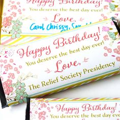 three candy bar wrappers sitting on top of each other with the words happy birthday written on them