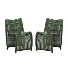 two green chairs sitting next to each other