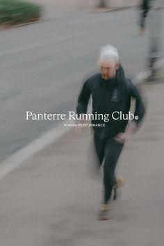 a blurry photo of a man riding a skateboard down a street with the words pantere running club on it