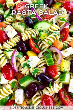 pasta salad with greek dressing and fresh veggies in the background text overlay