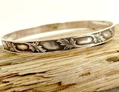 Vintage Art Nouveau Sterling Bangle Bracelet Lily Pattern Art Nouveau Inspired, Vintage Sterling Silver Bangle Bracelet Adoring, Lily Flower Leaf Pattern 1/4" Wide  7 3/4" Circumference  Marked Sterling On The Interior  jujubee1.etsy.com To Browse My Shop Lily Pattern, Silver Bangle Bracelet, Sterling Silver Bangle Bracelets, Sterling Silver Bangle, Flower Leaf, Sterling Silver Bangles, Lily Flower, Vintage Sterling Silver, Bangle Bracelet