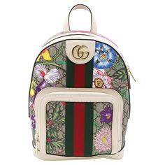 Gucci Ophidia small white ladies backpack featuring GG supreme canvas with multicolor floral motifs and double GG gold tone logo hardware on the front. Comes with a small front zip pocket and main zip around compartment with multiple interior card slots and an interior zip pocket. Gold tone hardware. Measurements: Length: 9 inches, Height: 11.5 inches, Depth: 4 inches. Handle drop: 3.5 inches. Shoulder strap drop: 8-12 inches. Made in Italy. Unworn condition. Dust bag and cards are included. No Gucci Bookbag, Flora Gucci, Day Backpacks, Gucci Ophidia, Small Lady, Buy Gucci, Gucci Models, Small Backpack, Canvas Backpack