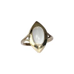 This stylish 9carat gold ring holds a moonstone cabochon surrounded by a glossy gold frame and split shoulders. Fully hallmarked Birmingham 1967. Ring size : L 1/2 or 6 Stone Dimensions: 10x7mm Weight: 2.7g Multi Gem Ring, Edwardian Ring, Pearl And Diamond Ring, Gold Cocktail Ring, Ladies Ring, Unusual Jewelry, Diamond Cocktail Rings, Gem Ring, Halo Diamond Ring