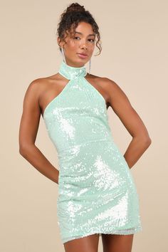 If you have iconic intentions, then the Lulus Sensational Purpose Mint Sequin Halter Tulip Mini Dress is the perfect look to achieve them! A multitude of dazzling clear sequins dance across this stunning dress that features a sleeveless darted bodice and a high, halter neckline (with two button-loop closures at back). The fitted waist tops a tulip-style skirt that boasts an overlapping panel that gathers at the side and finishes at a flirty mini hem. Hidden back zipper/clasp. Fit: This garment f Bach Trip Outfits, Green Sequin Dress, Sequin Halter Dress, Mint Green Dress, Sequin Halter, Trip Outfits, Adhesive Bra, Green Sequins, Sparkly Dress