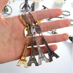 Description: Product Name:Eiffel Tower Key Chain Product Size:9.5x2cm Product Material:Metal Alloy   Color:Bronze,Gold,Silver,Copper    Package Include: 4pcs Random Color Key Rings. Appearance:It's Eiffel Tower which is Romantic and fashion,a good present for family and lover.   Package Includ:4pcs Keychain       On Jun 19, 2022 at 22:49:27 PDT, seller added the following information: Eiffel Tower Keychain, Paris Tower, Motorcycle Keychain, Paris Tour Eiffel, Color Key, Keychain Fob, Keychain Bag, Paris Eiffel Tower, 2017 Fashion