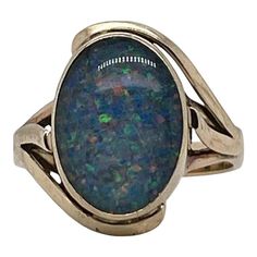 A very fine vintage gold and opal signet style ring.  With oval opal doublet cabochon bezel set in 9ct gold.   Simply a great ring!  Date: 20th Century  Overall Condition: It is in overall good, as-pictured, used estate condition with some very fine & light surface scratches and other signs of expected light wear consistent with age.  Fineness: Marked 9ct for gold fineness.    Marks: 9ct  Measurements: Height: ca. 23 mm Length: ca. 17 mm Width: ca. 19 mm  Weight: ca. 3.5 grams  Ring Size: 6.75 Signet Ring, Cocktail Rings, Bezel Setting, Vintage Gold, 20th Century, Opal, Jewelry Rings, Ring Size, Size 6