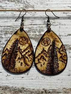 One of a kind wood burned earrings. Featuring a scenic Mountain View under a night skyline with full moon. Wood Burned Earrings, Wood Jewelry Diy, Night Skyline, Hand Burn, Earrings Wood, Wood Jewelry, Wedding Jewelry Earrings, Wood Jewellery, Jewelry Diy