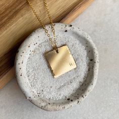 "This beautiful square pendant necklace is great when warn alone and also layers well with other necklaces! Necklace makes the perfect gift for yourself or someone else. You can customize the length for what works best for you! If you need a different length please put that in \"notes to seller\" at checkout. DETAILS: *Disc is 18mm x 18mm with hammered edges *14k Gold Fill Chain *14k Gold Fill Clasp *USA materials *Packaged in gift box with tie bow HOW IT'S MADE: *All items are MADE TO ORDER and Everyday Personalized Square Pendant Necklaces, Everyday Hand Stamped Rectangular Necklace, Everyday Rectangular Hand Stamped Necklace, Everyday Handmade Rectangular Necklaces, Handmade Rectangular Everyday Necklace, Everyday Handmade Rectangular Necklace, Minimalist Square Pendant Necklace As Gift For Her, Hammered Square Pendant Jewelry For Gift, Personalized Square Pendant Jewelry For Everyday