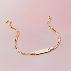 A classic engravable tag id bracelet for baby girls and boys that features an elegant figaro chain. This bracelet is crafted from genuine 14k yellow gold, a material that is safe for your baby with sensitive skin. This classic bracelet makes for a beautiful gift for a baby or toddlers special birthday. Gift box included with purchase. Gold Bracelet For Kids Boys, Baby Boy Bracelet Gold Kids, Kids Bracelets Gold, Gold Circle Ring, Figaro Bracelet, Boys Bracelets, Kids Bracelet, Kids Bracelets, Classic Bracelets